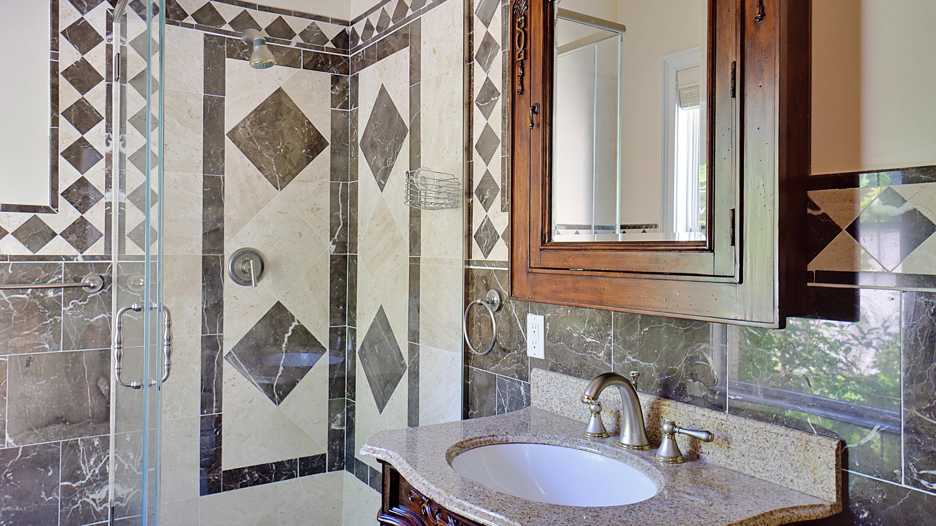 79 Hupi Road Monterey, MA 01245 - Photo 9 of 33 a bathroom with a sink toilet and shower