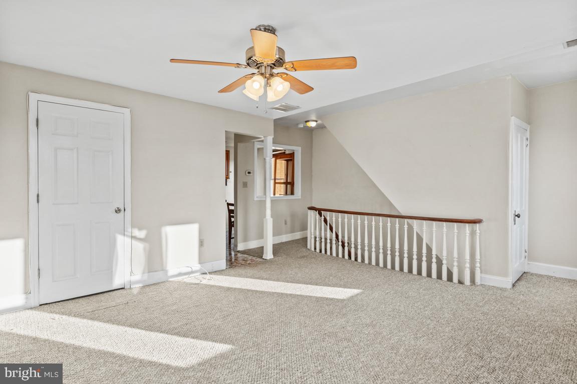201 North Line Street Lansdale, PA 19446 - Photo 2 of 24 a view of a livingroom with a ceiling fan and entryway