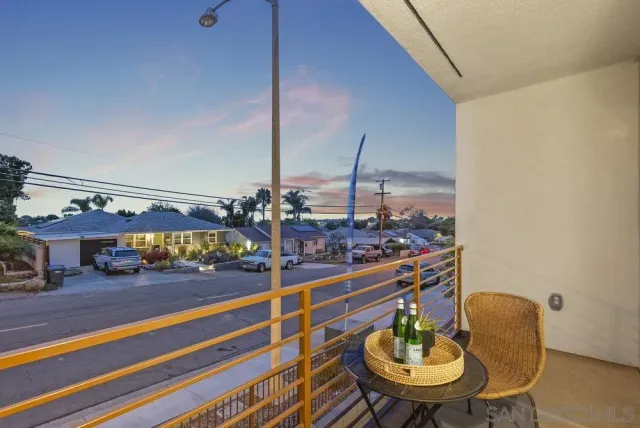 a view of a chairs and table in patio