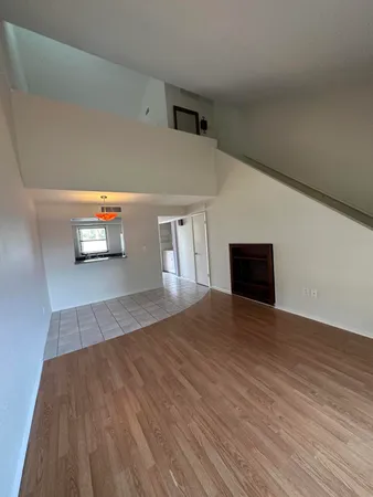 a view of a livingroom with wooden floor