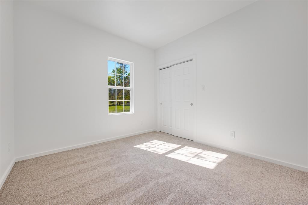 540 Southeast 2nd Street Cooper, TX 75432 - Photo 22 of 30 an empty room with windows