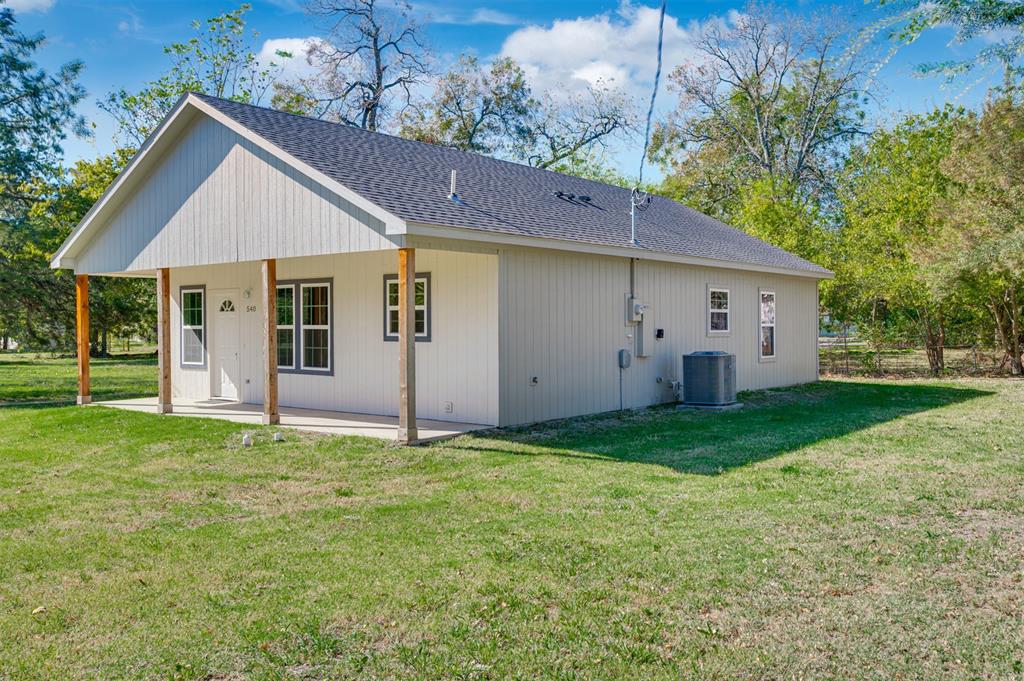 540 Southeast 2nd Street Cooper, TX 75432 - Photo 4 of 30 a view of a house with backyard
