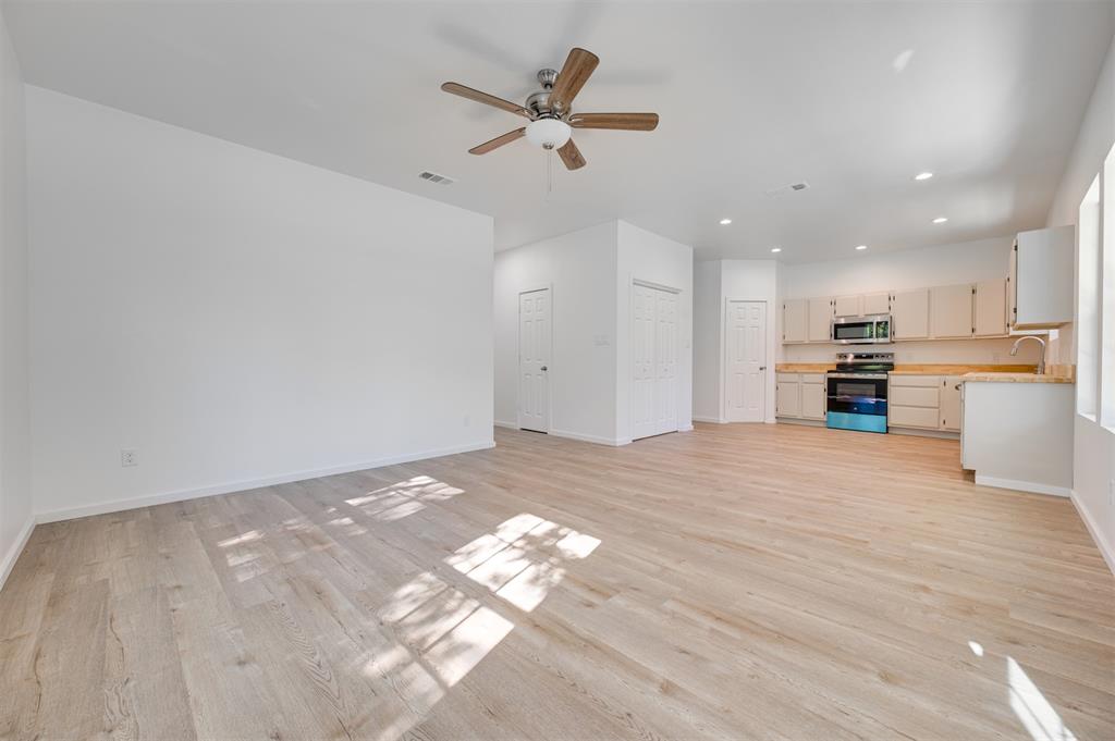540 Southeast 2nd Street Cooper, TX 75432 - Photo 7 of 30 a view of an empty room with a kitchen