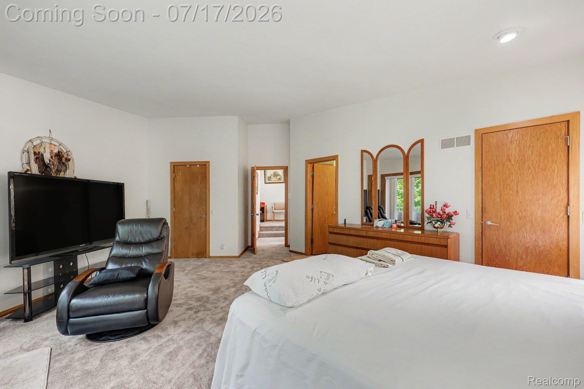 5685 Paint Valley Drive Rochester, MI 48306 - Photo 20 of 66 Carpeted room with white walls, wood-finish interior doors, and a recessed ceiling light