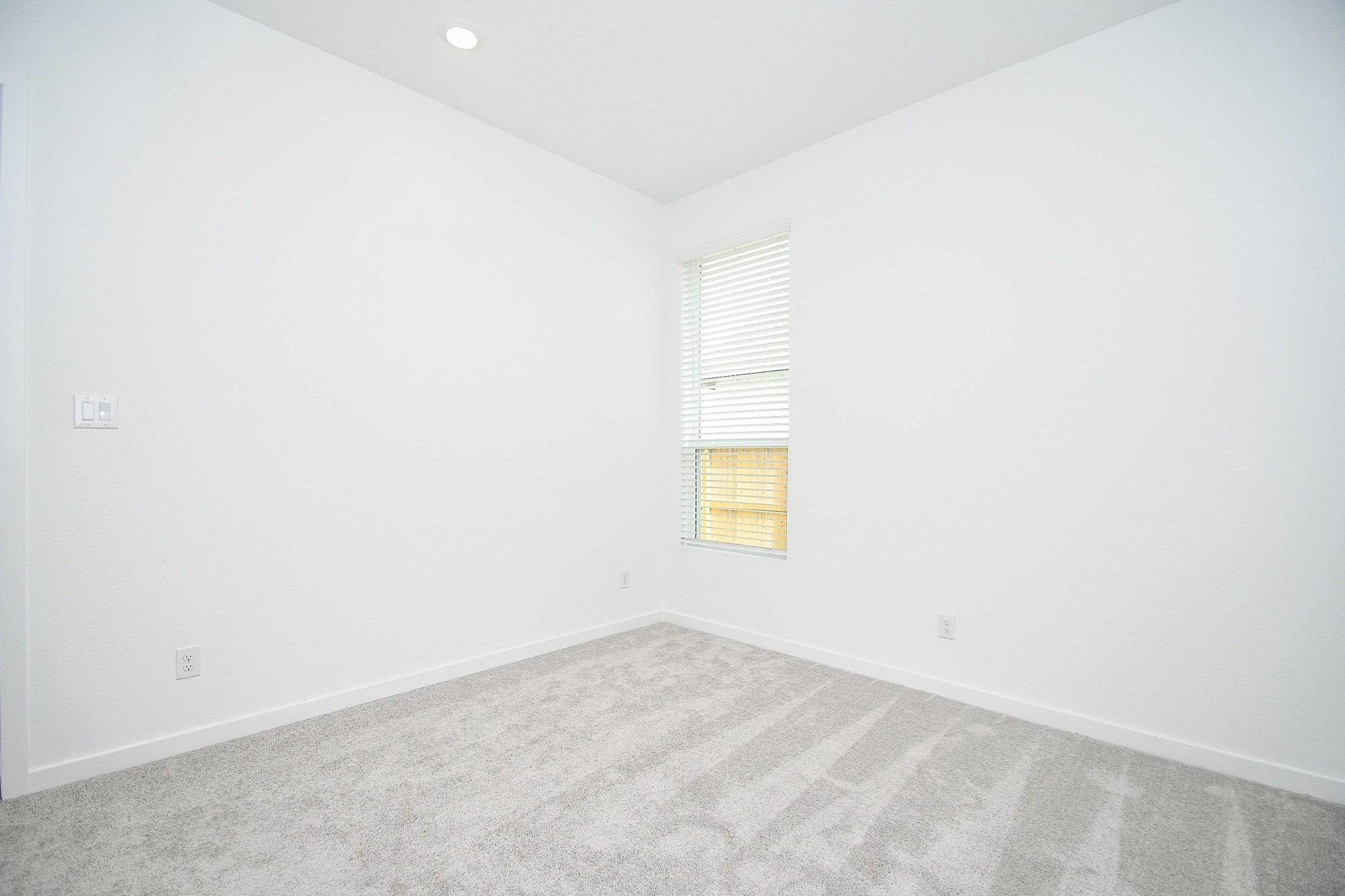 4227 Eagle Pass Drive Rosenberg, TX 77469 - Photo 19 of 28 a view of an empty room and a window