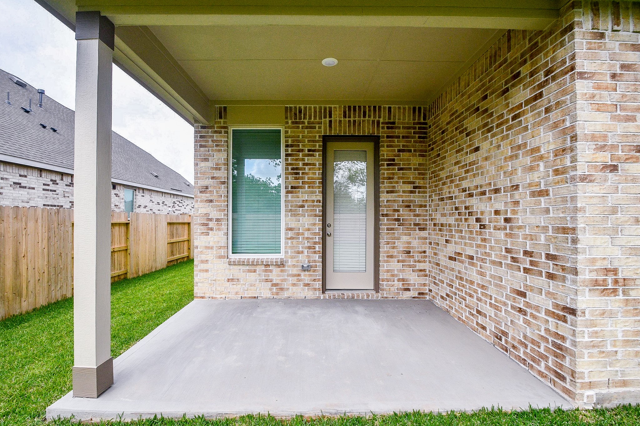 4227 Eagle Pass Drive Rosenberg, TX 77469 - Photo 27 of 28 a view of a brick house with a large door