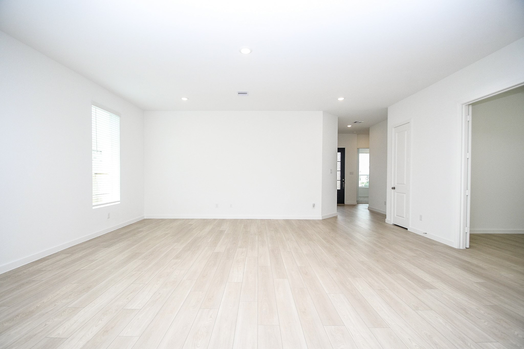 4227 Eagle Pass Drive Rosenberg, TX 77469 - Photo 10 of 28 an empty room with wooden floor