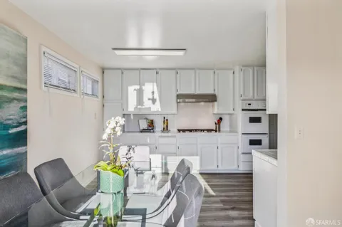 a table with a vase and flowers on it