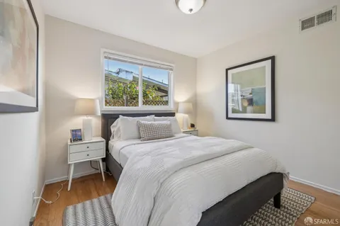 a bathroom with a sink a mirror a shower and vanity