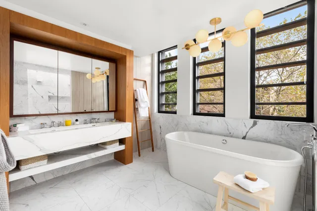 a view of a room with a table and chairs