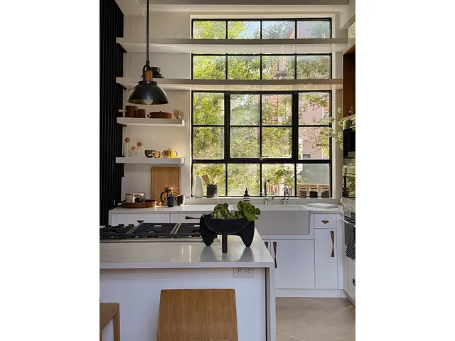 a dining room with furniture and a window