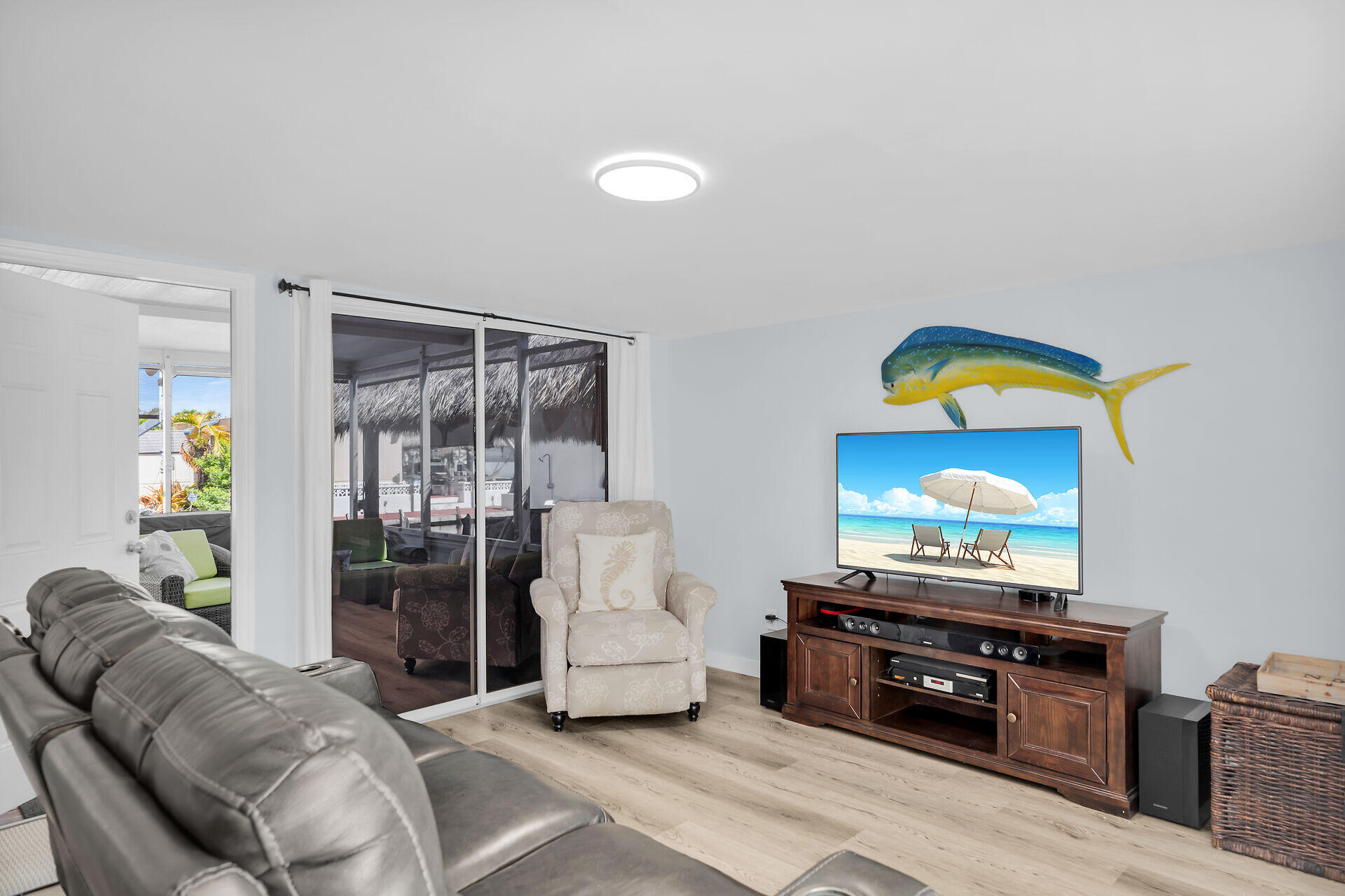 209 Buttonwood Avenue Key Largo, FL 33037 - Photo 11 of 46 a living room with furniture and a flat screen tv