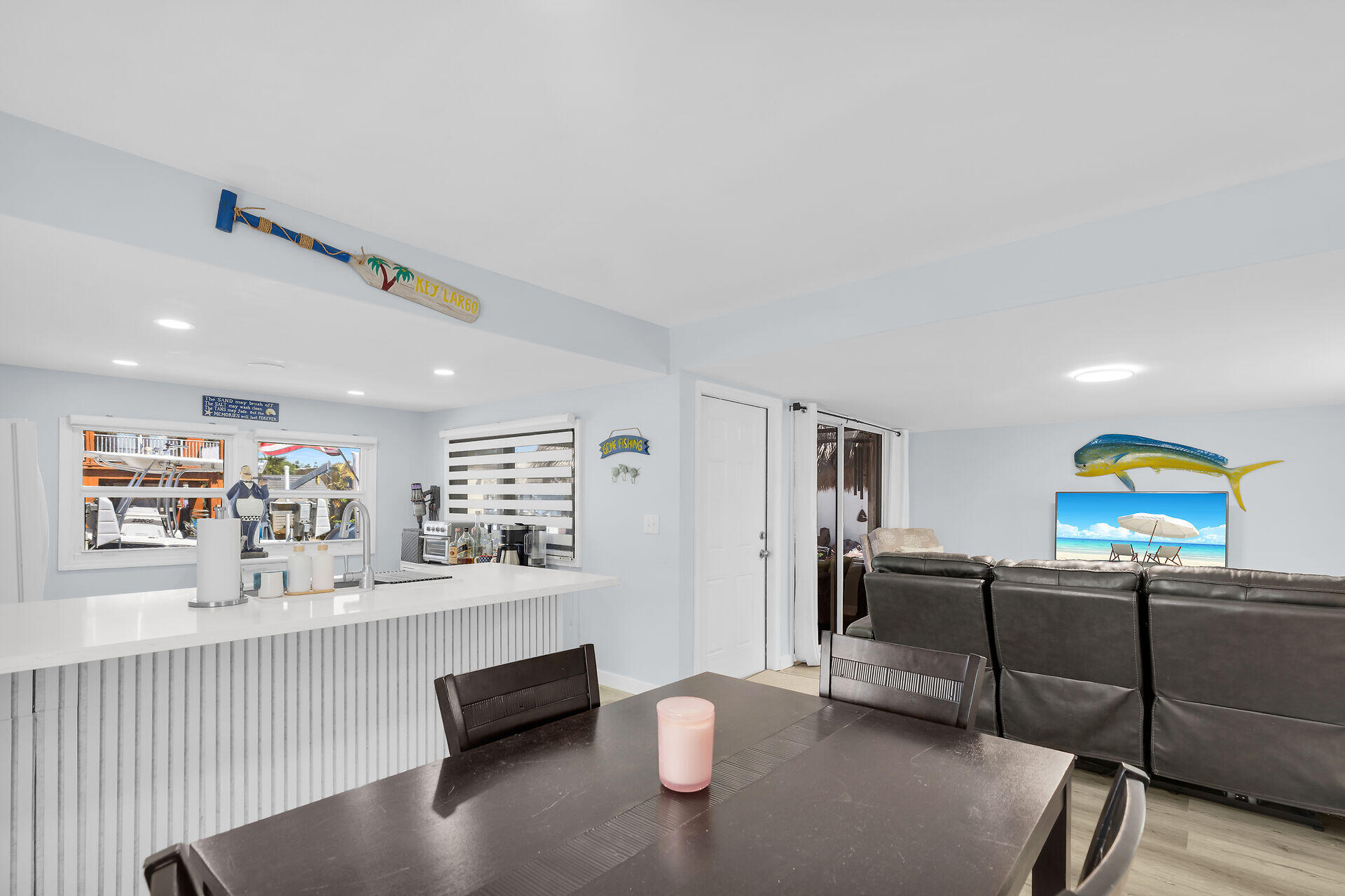 209 Buttonwood Avenue Key Largo, FL 33037 - Photo 15 of 46 a living room with furniture and a flat screen tv