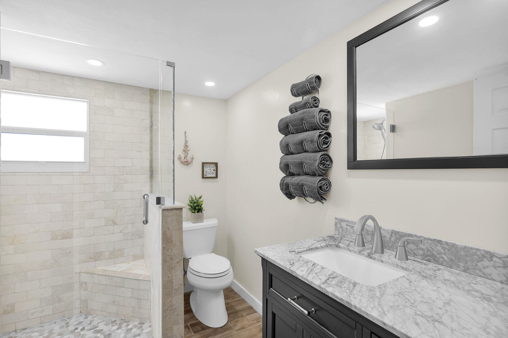 209 Buttonwood Avenue Key Largo, FL 33037 - Photo 2 of 46 a bathroom with a granite countertop sink a toilet and a mirror
