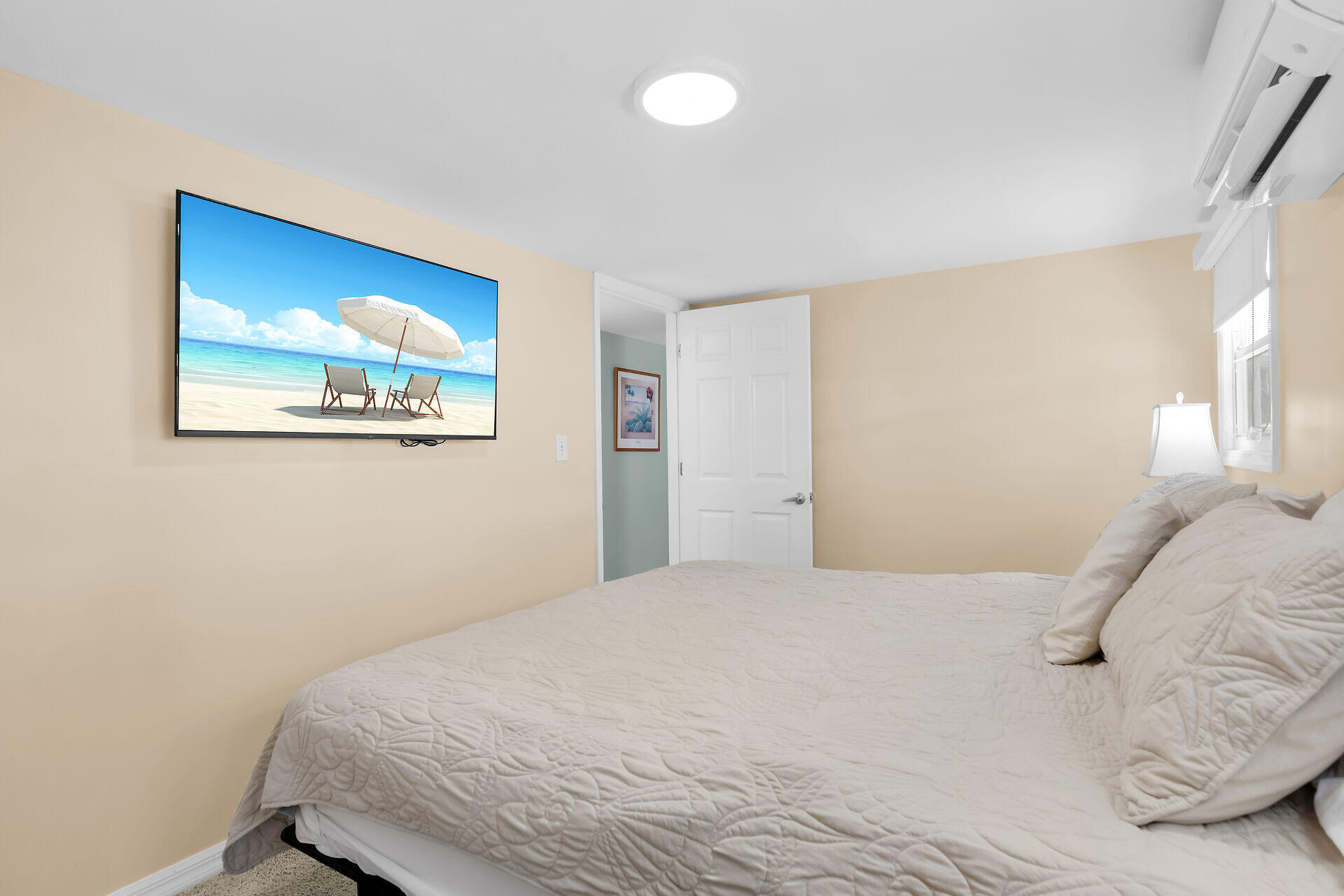 209 Buttonwood Avenue Key Largo, FL 33037 - Photo 25 of 46 a bedroom with a large bed and a window