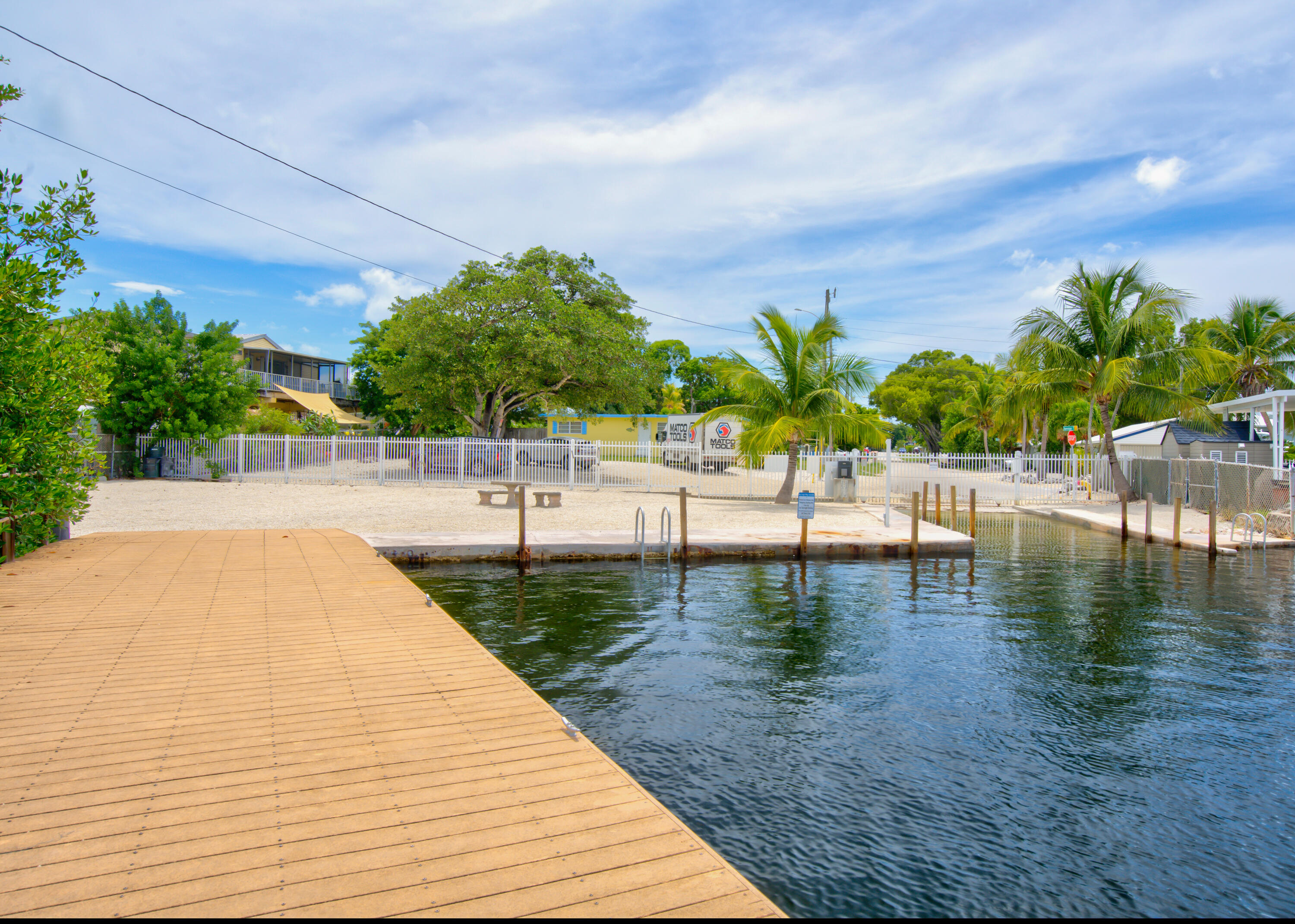 209 Buttonwood Avenue Key Largo, FL 33037 - Photo 38 of 46 a view of swimming pool with outdoor seating and plants