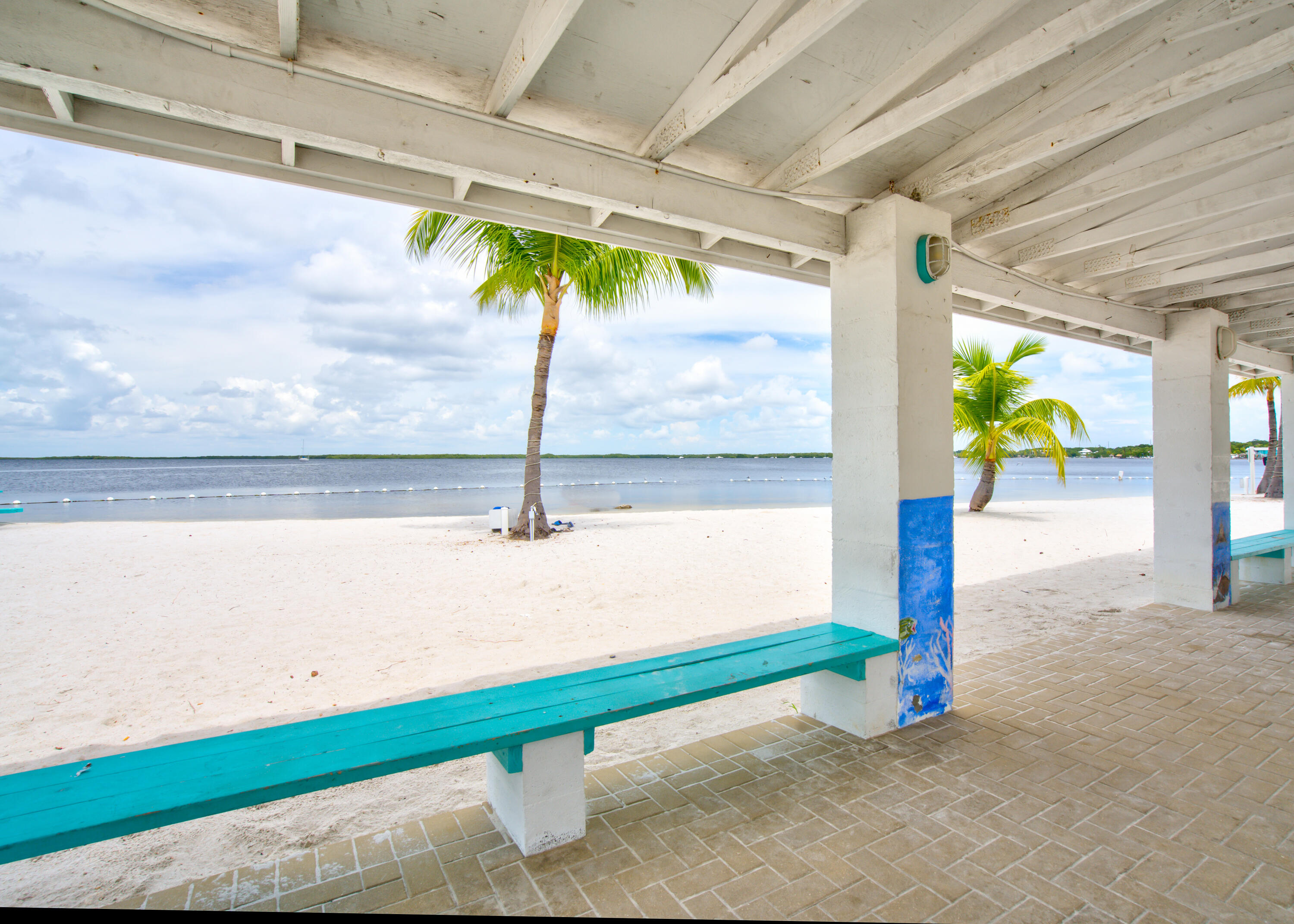209 Buttonwood Avenue Key Largo, FL 33037 - Photo 41 of 46 a view of a porch with a table and chairs