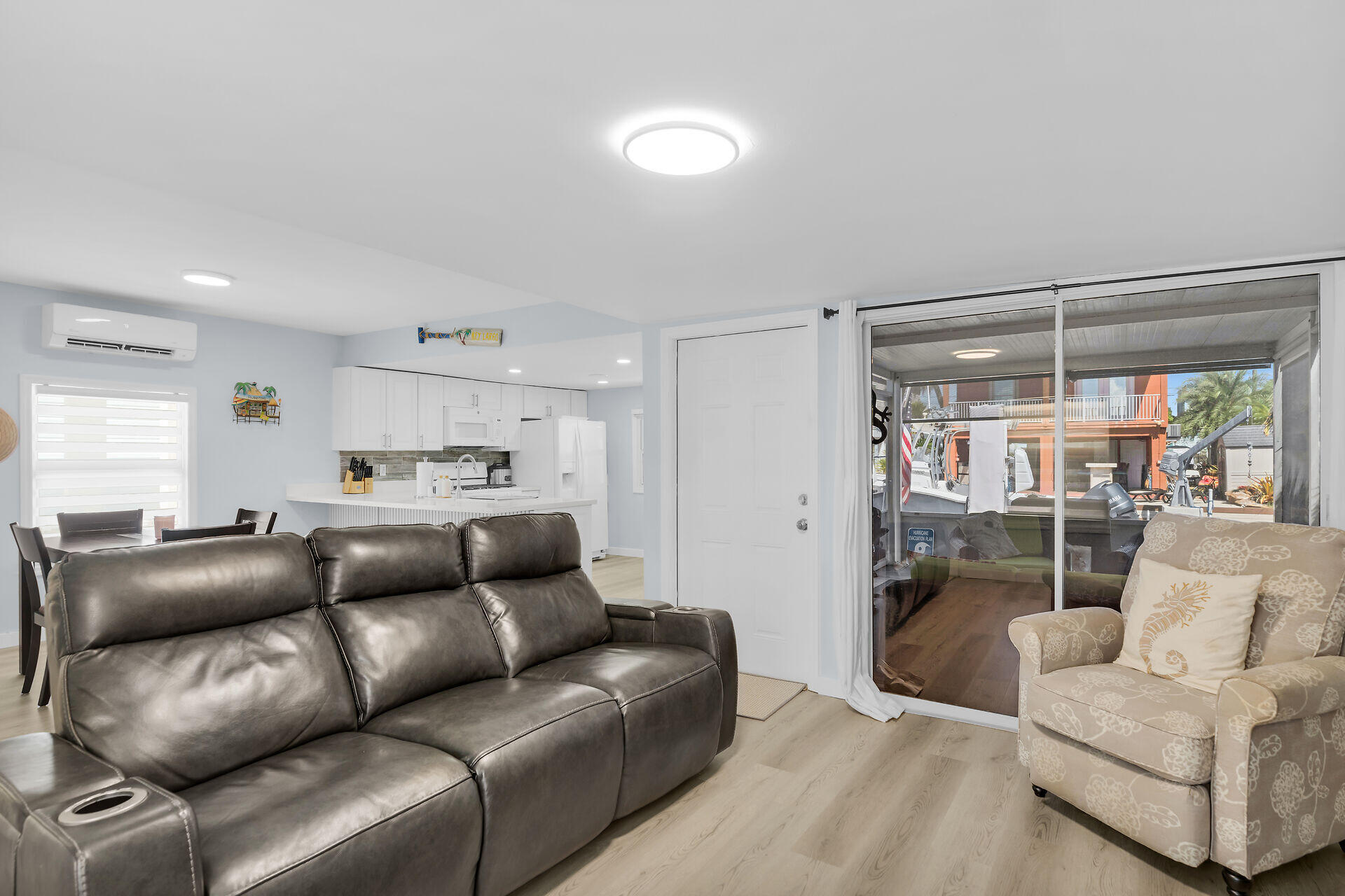 209 Buttonwood Avenue Key Largo, FL 33037 - Photo 10 of 46 a living room with furniture and a glass door