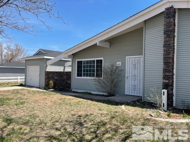 12192 Andes Street Reno, NV 89506 - Photo 1 of 17 a front view of a house