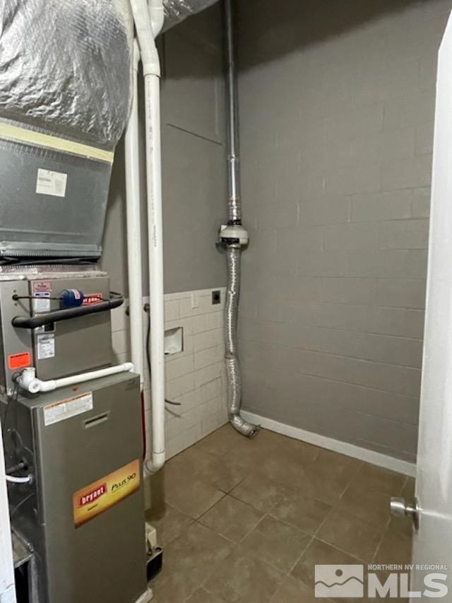 12192 Andes Street Reno, NV 89506 - Photo 6 of 17 a room with water heater and a cabinet