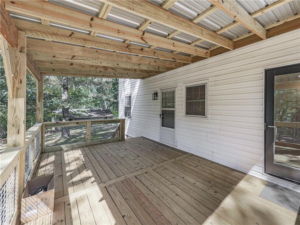 633 Butterworth Road Canton, GA 30114 - Photo 42 of 55 a view of a porch with a bench