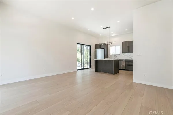 a view of a kitchen with a sink and a microwave