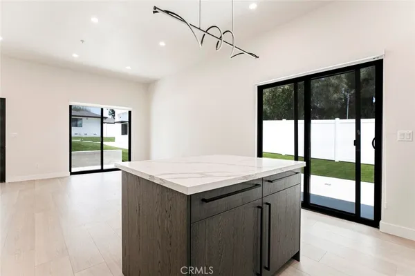 a room with a large window and pool table