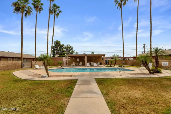 a view of a swimming pool with a chair