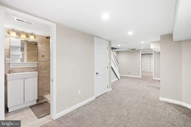 a bathroom with a toilet sink and shower