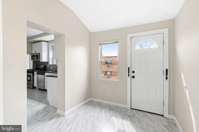 an empty room with windows and closet