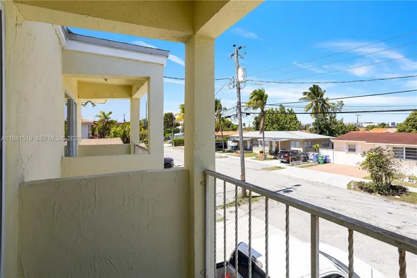 a view of a balcony and front door