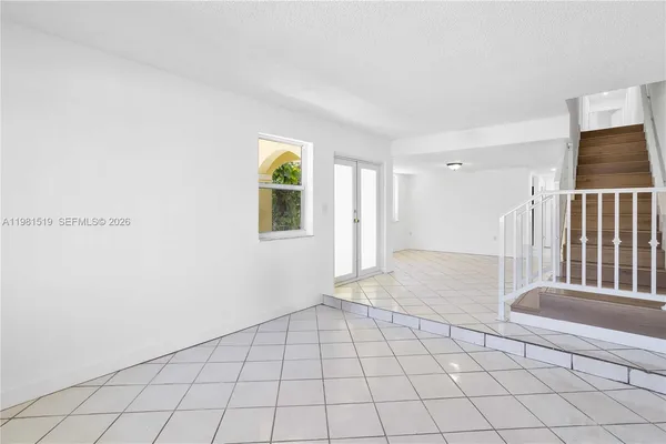 a view of an empty room and window