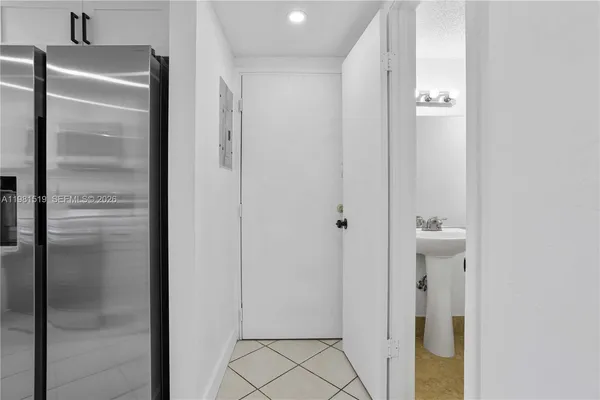 a bathroom with a glass shower door
