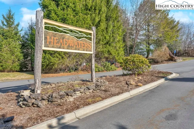 a view of a house with snow on the road