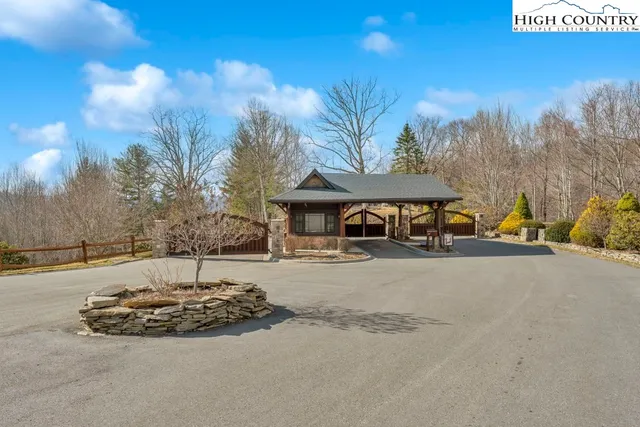 a sitting area with furniture and wooden floor
