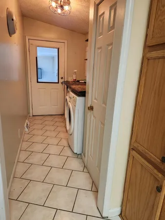 a view of a utility room with a sink