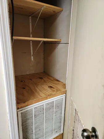 a stove top oven sitting inside of a kitchen