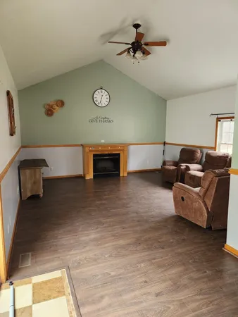 a view of a floor to ceiling window with wooden floor