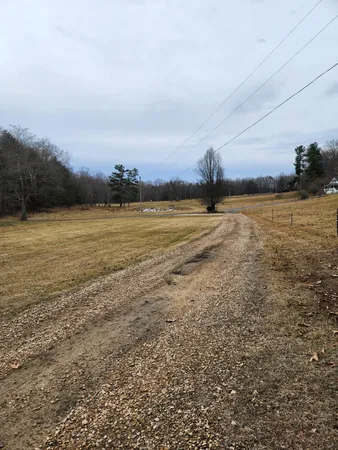 a view of room with window and refrigerator
