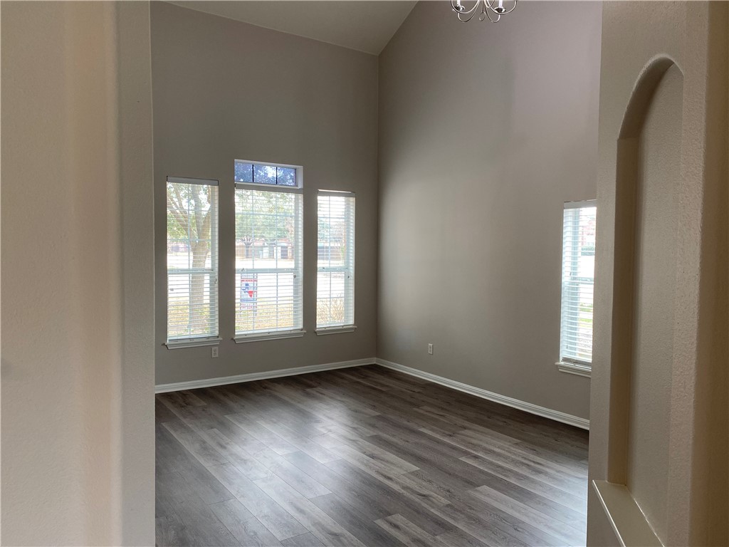 2700 Saddle Blanket Place Leander, TX 78641 - Photo 4 of 23 an empty room with wooden floor and windows
