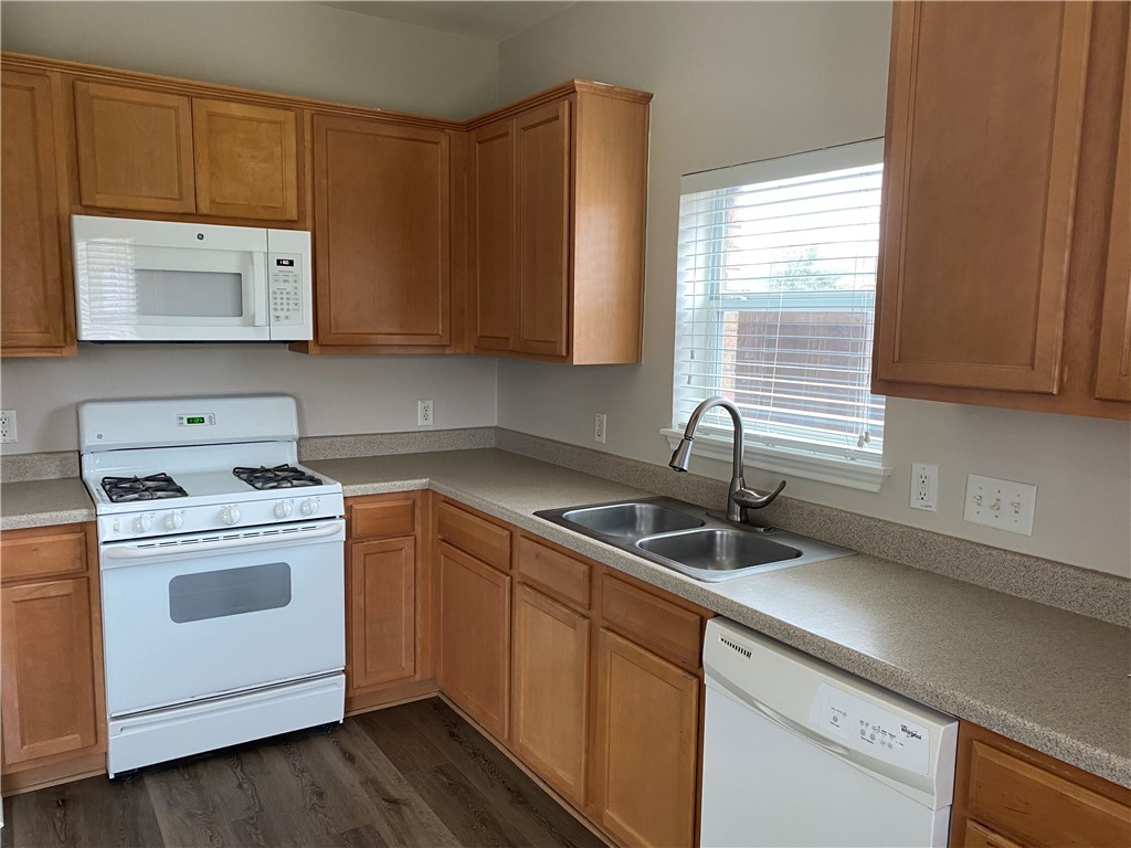2700 Saddle Blanket Place Leander, TX 78641 - Photo 7 of 23 a kitchen with a sink cabinets and window