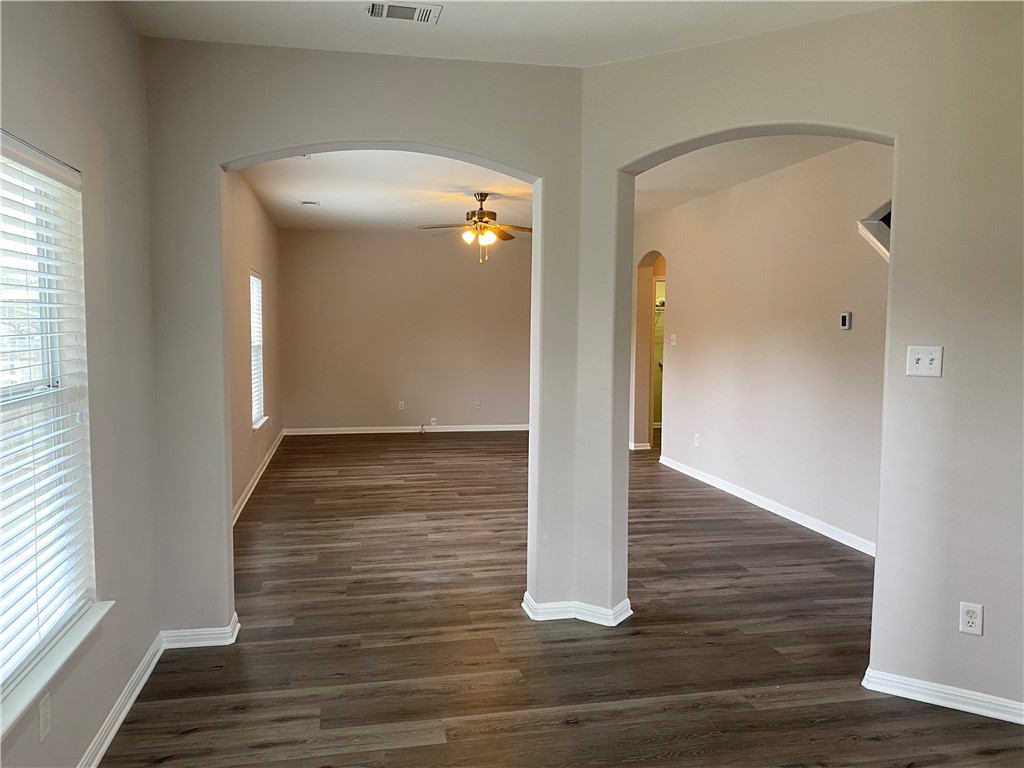 2700 Saddle Blanket Place Leander, TX 78641 - Photo 9 of 23 a view of a hallway with wooden floor