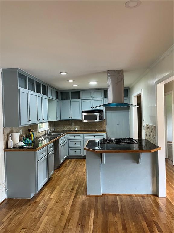 1432 Spring Valley Lane Lilburn, GA 30047 - Photo 5 of 11 a kitchen with stainless steel appliances granite countertop a stove a sink and a refrigerator