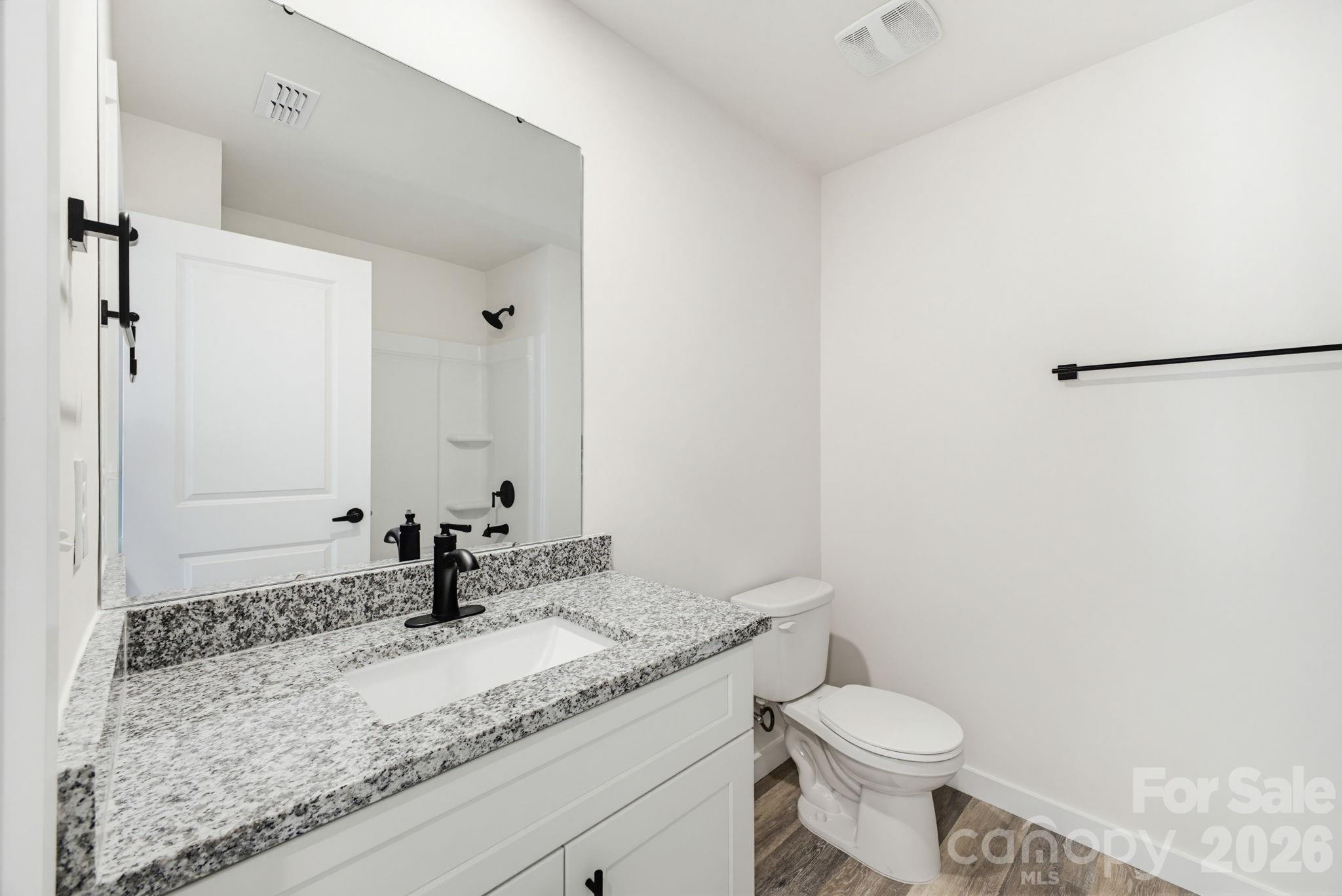 701 2nd St Place Southwest Conover, NC 28613 - Photo 14 of 16 a bathroom with a granite countertop sink and a mirror