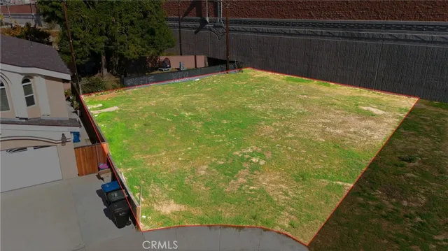 a view of a swimming pool with a bench in patio