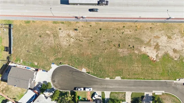 a view of a swimming pool with a table and chairs