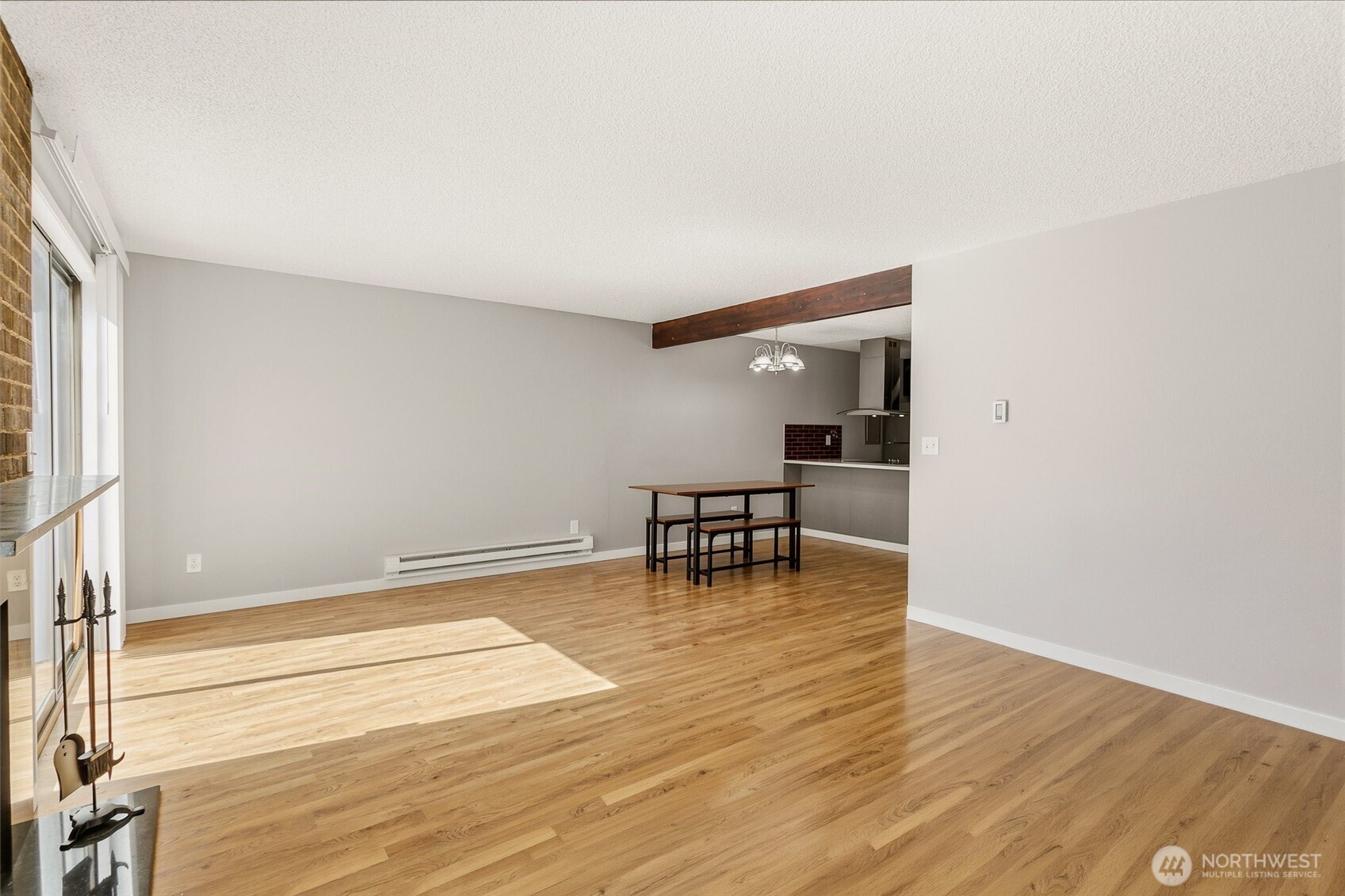 1802 Maple Lane, Unit A5 Kent, WA 98030 - Photo 5 of 27 a view of an empty room with wooden floor and a window