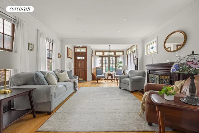 a picture of a room with a white wall and a large mirror