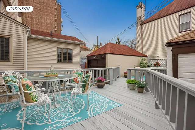 a kitchen with stainless steel appliances a stove a sink dishwasher a refrigerator and white cabinets with wooden floor