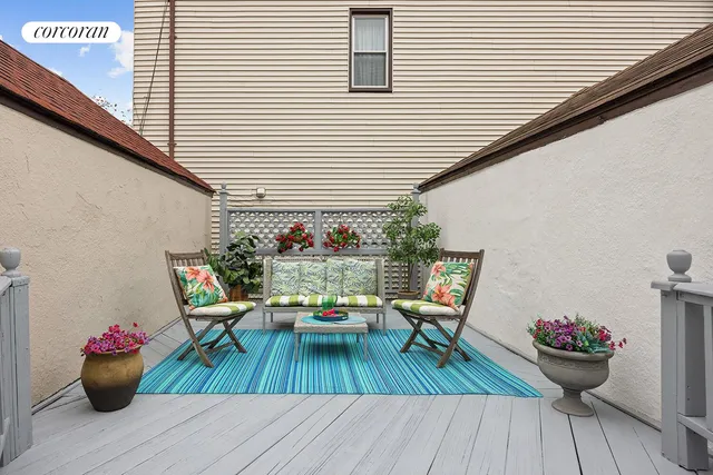 a view of house with patio outdoor seating and wooden floor